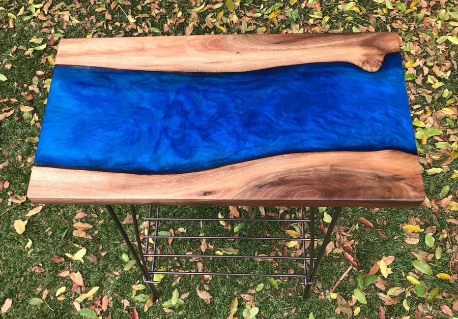 Image of Claro black walnut table with blue resin "A river runs through it"!