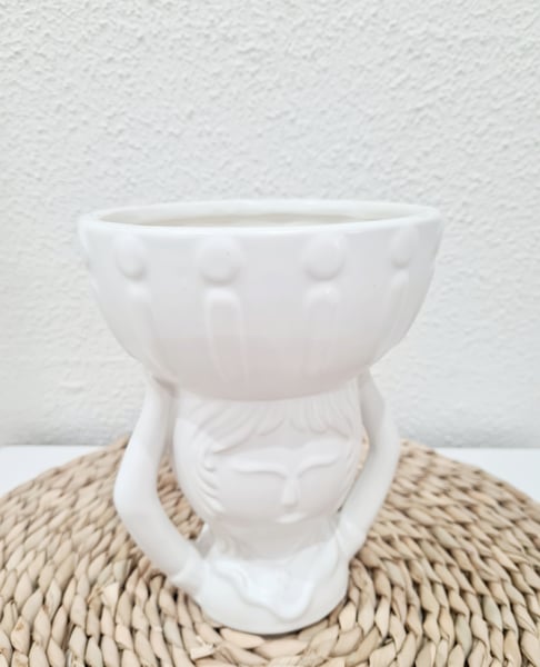 Image of Lady with basket vase.