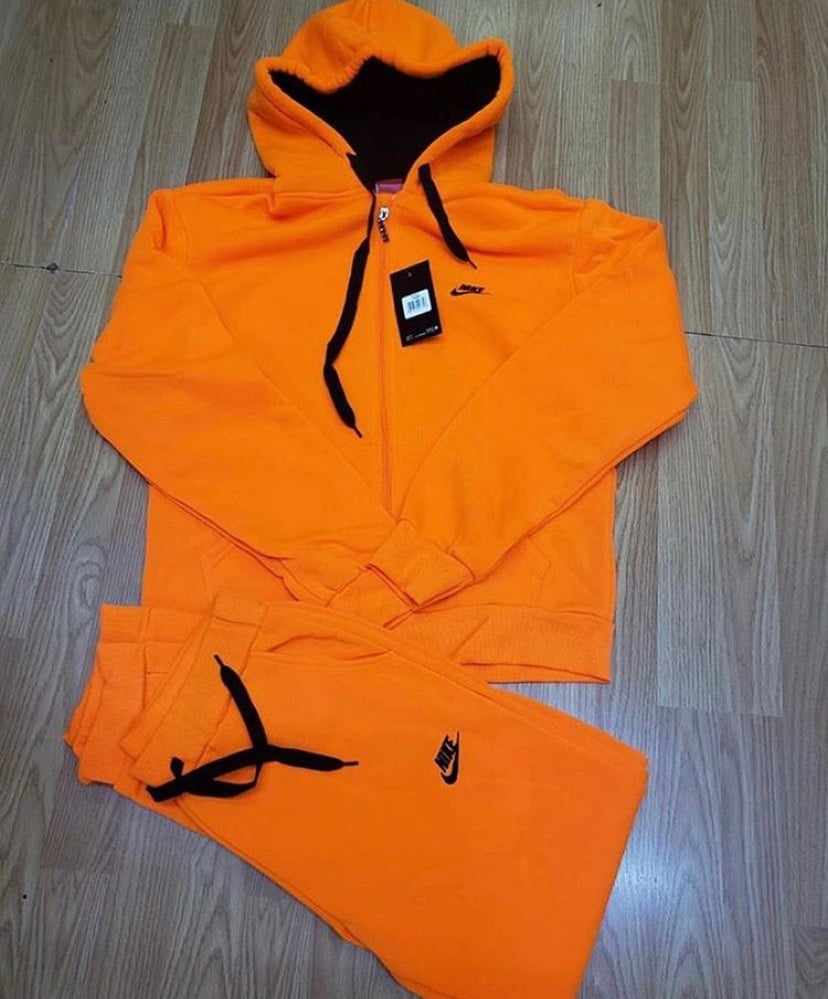 blue and orange nike jogging suit