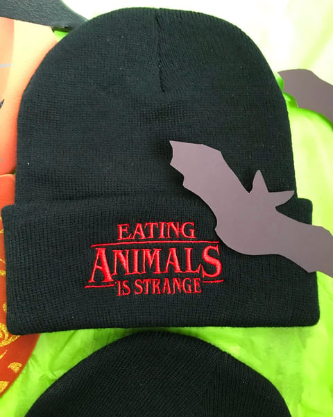 Image of Eating animals is strange beanie 