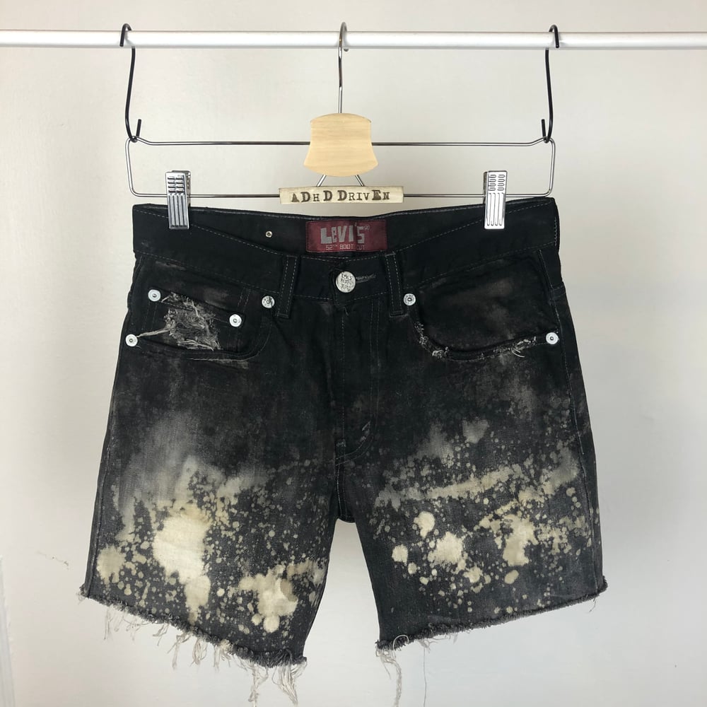 Image of Waxed denim shorts 