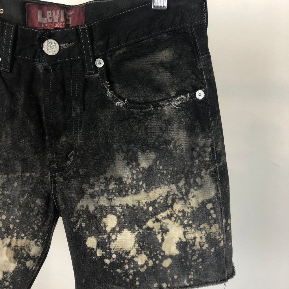 Image of Waxed denim shorts 