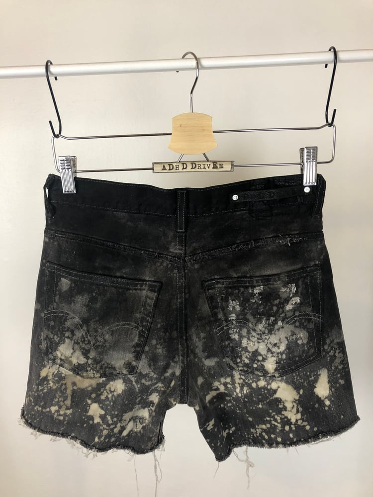 Image of Waxed denim shorts 