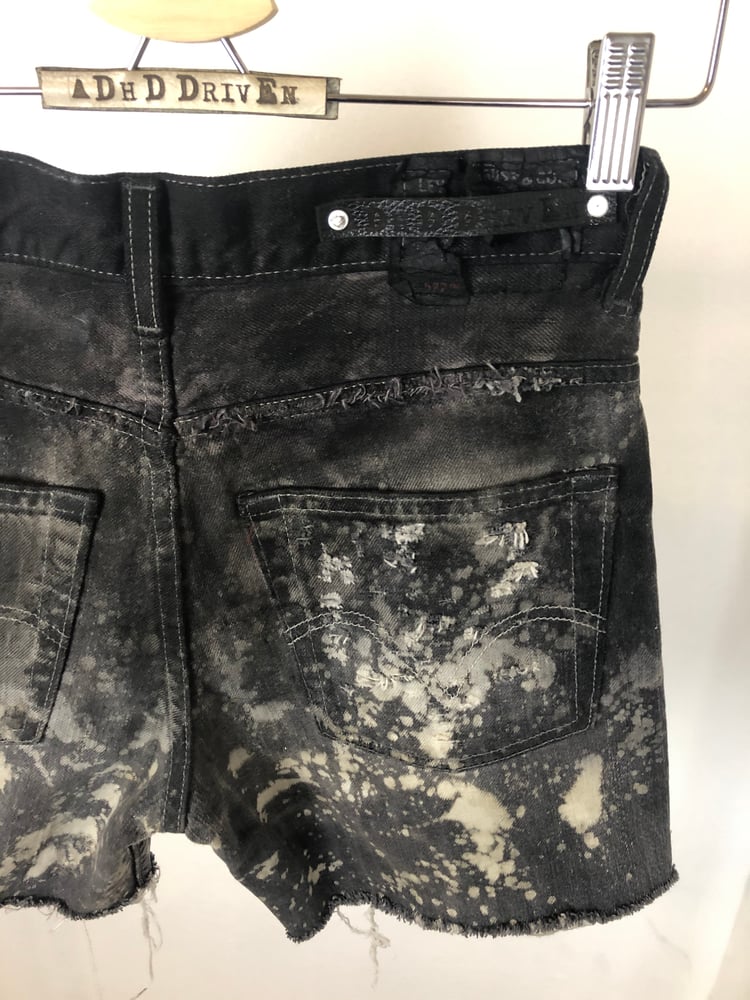 Image of Waxed denim shorts 