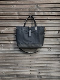 Image 4 of Black tote bag in waxed canvas with leather bottom and cross body strap