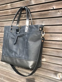 Image 2 of Black tote bag in waxed canvas with leather bottom and cross body strap