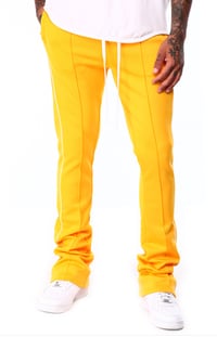 Image 1 of Stacked Track Pants Yellow 