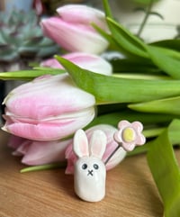 Image 1 of Ceramic Cute Bunny holding a pastel Flower