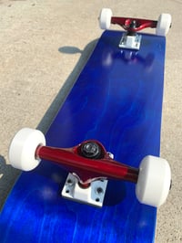 Image 4 of Blue Stained Complete Skateboard w/ Metallic Red Trucks