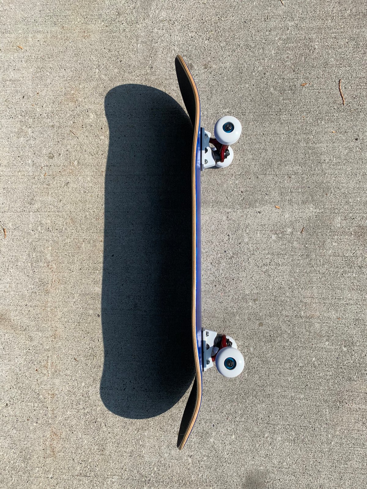 Image of Blue Stained Complete Skateboard w/ Metallic Red Trucks