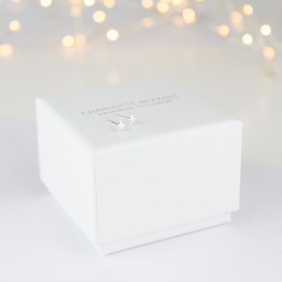 Image of Teeny silver star studs