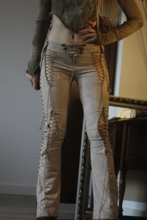 Image of THE PILGRIM STUDDED SNAKE LACE UP BOOTCUT PANTS