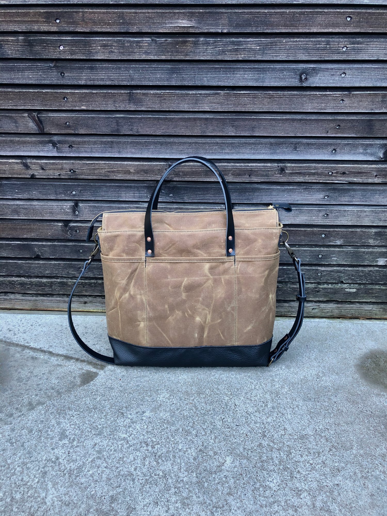 Image of Office tote bag in waxed canvas with luggage handle attachment leather handles and shoulder strap