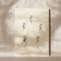 Image 1 of Hands Holding Flowers