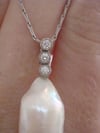 18ct white gold large baroque pearl and diamond pendant 
