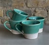 Glossy green mugs