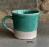 Glossy green mugs