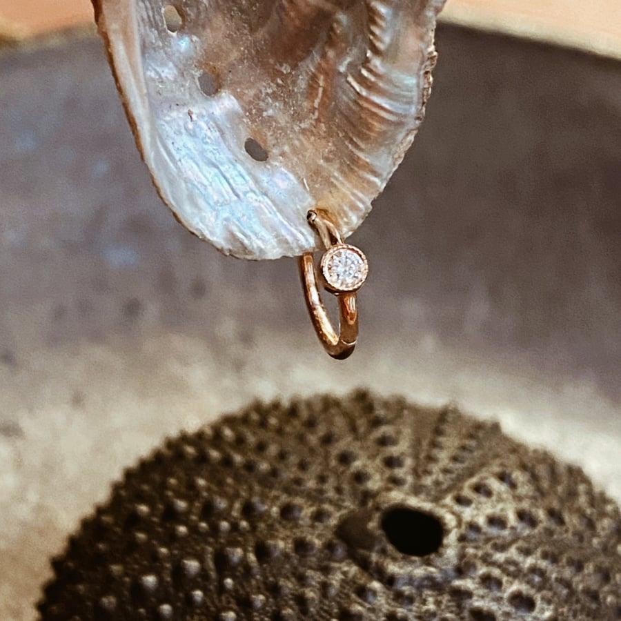 Image of SCALLOPED DIAMOND HOOP EARRING.