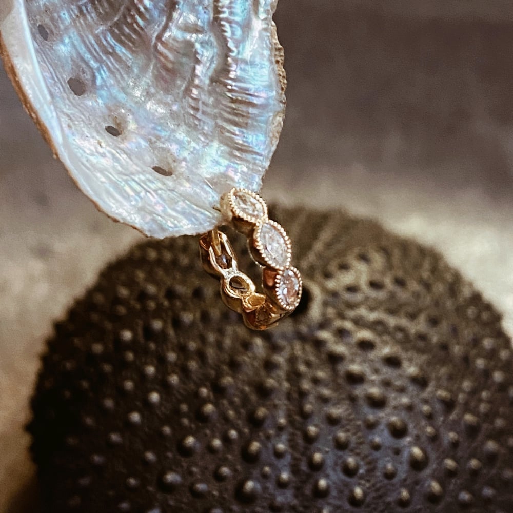 Image of DIAMOND MARQUISE SCALLOPED ETERNITY HOOP EARRING. 