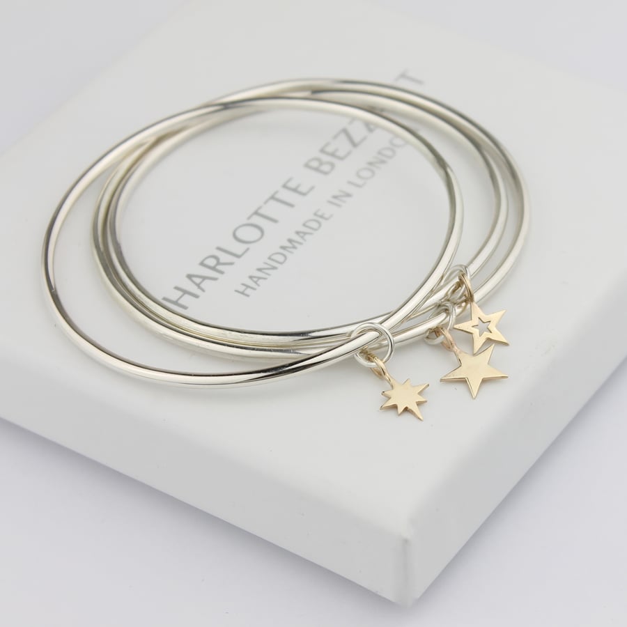 Image of Set of three star bangles in silver and 9ct gold