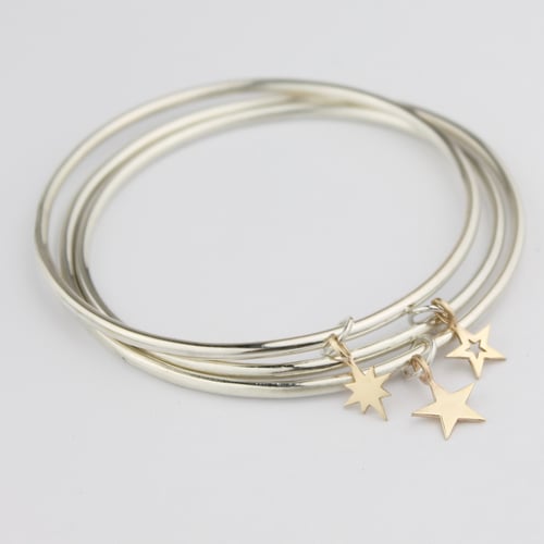 Image of Set of three star bangles in silver and 9ct gold