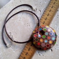 Image of round pencil pendant