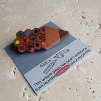 Image of pencil shaped brooch