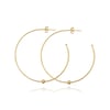 Large gold hoops with a single bead