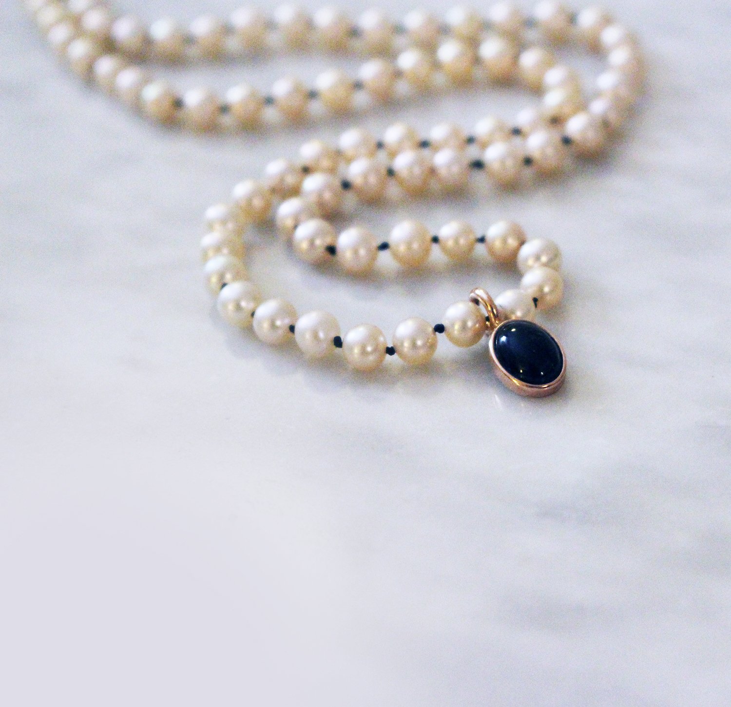 Pearl necklace with black onyx and mother of pearl - Kitsinian Jewelers