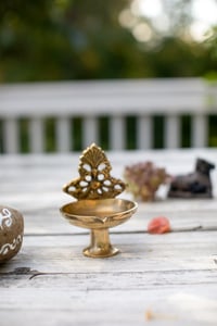 Image 2 of Brass lamp with intricate backdrop