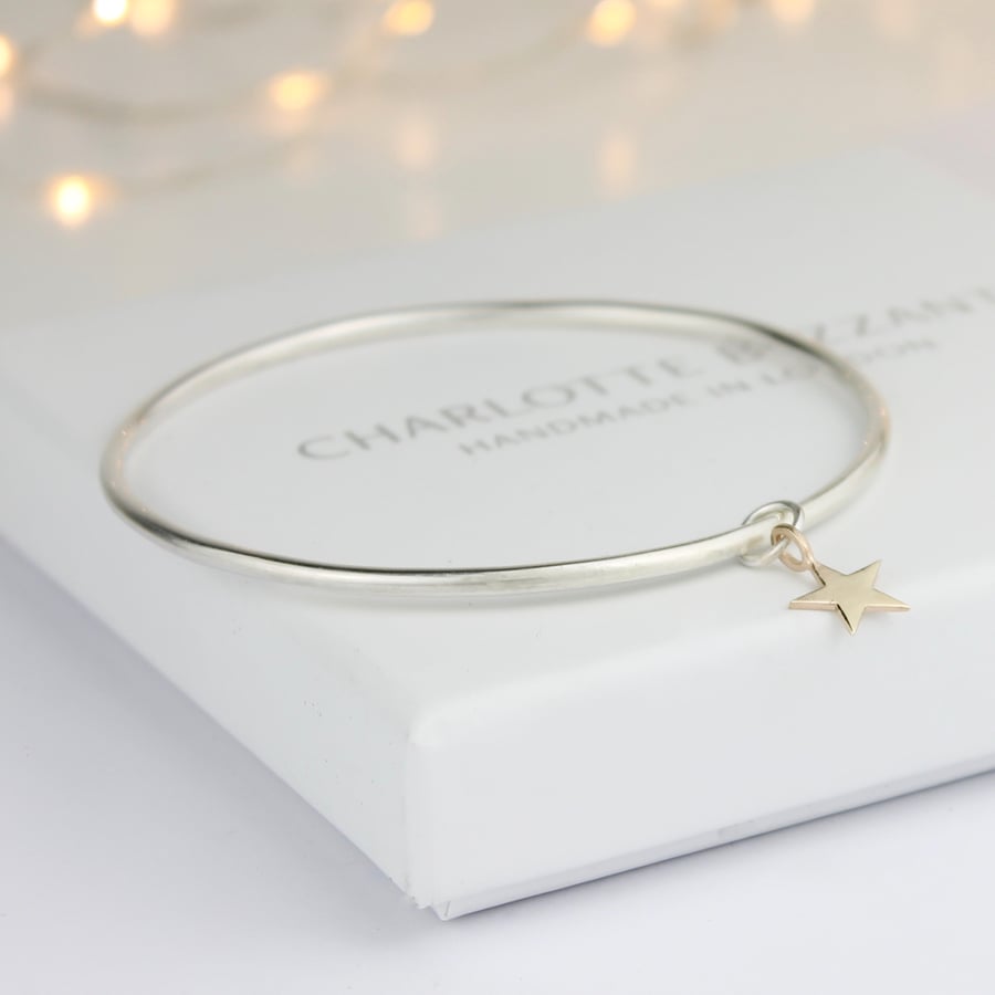Image of Handmade silver bangle with 9ct gold five pointed star