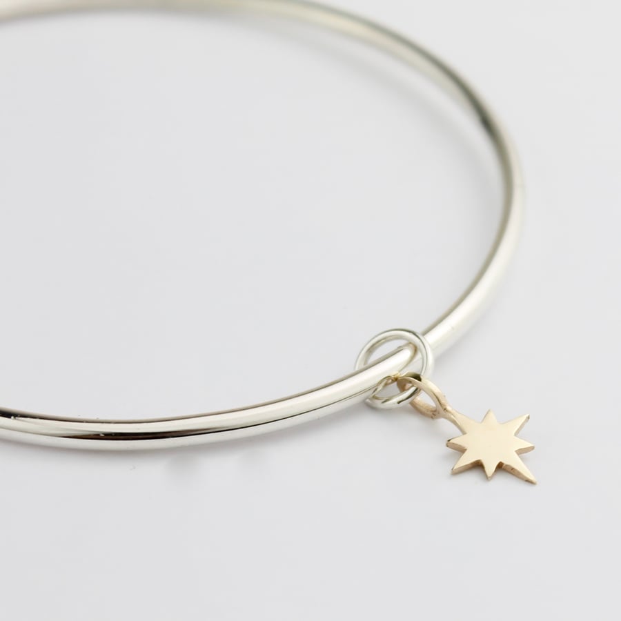 Image of Handmade silver bangle with 9ct yellow gold eight pointed star