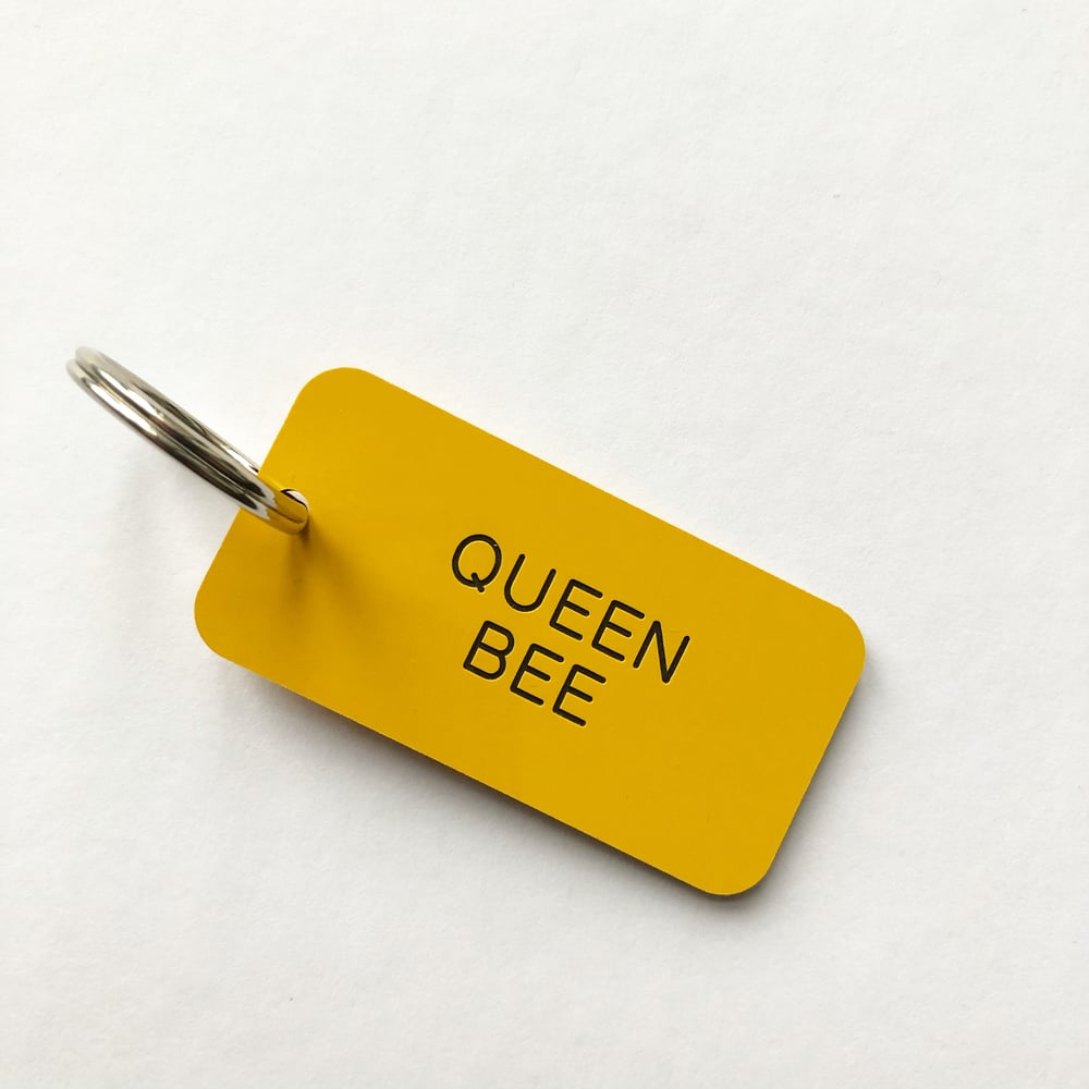Image of QUEEN BEE LOCKER KEYRING IN YELLOW + BLACK