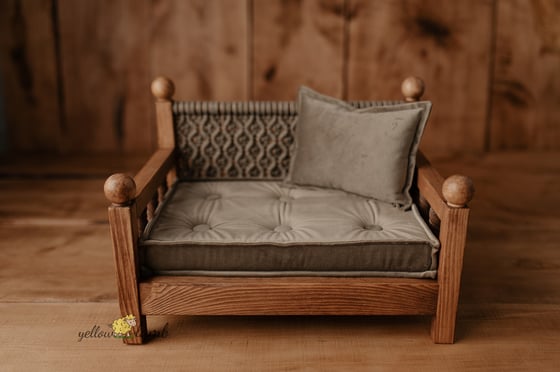 Image of « brown bench with taupe macrame nad mattress with pillow » 