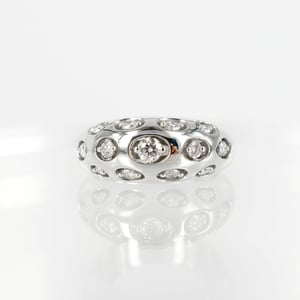 Image of 14ct white gold domed diamond set cocktail ring.      pj5458