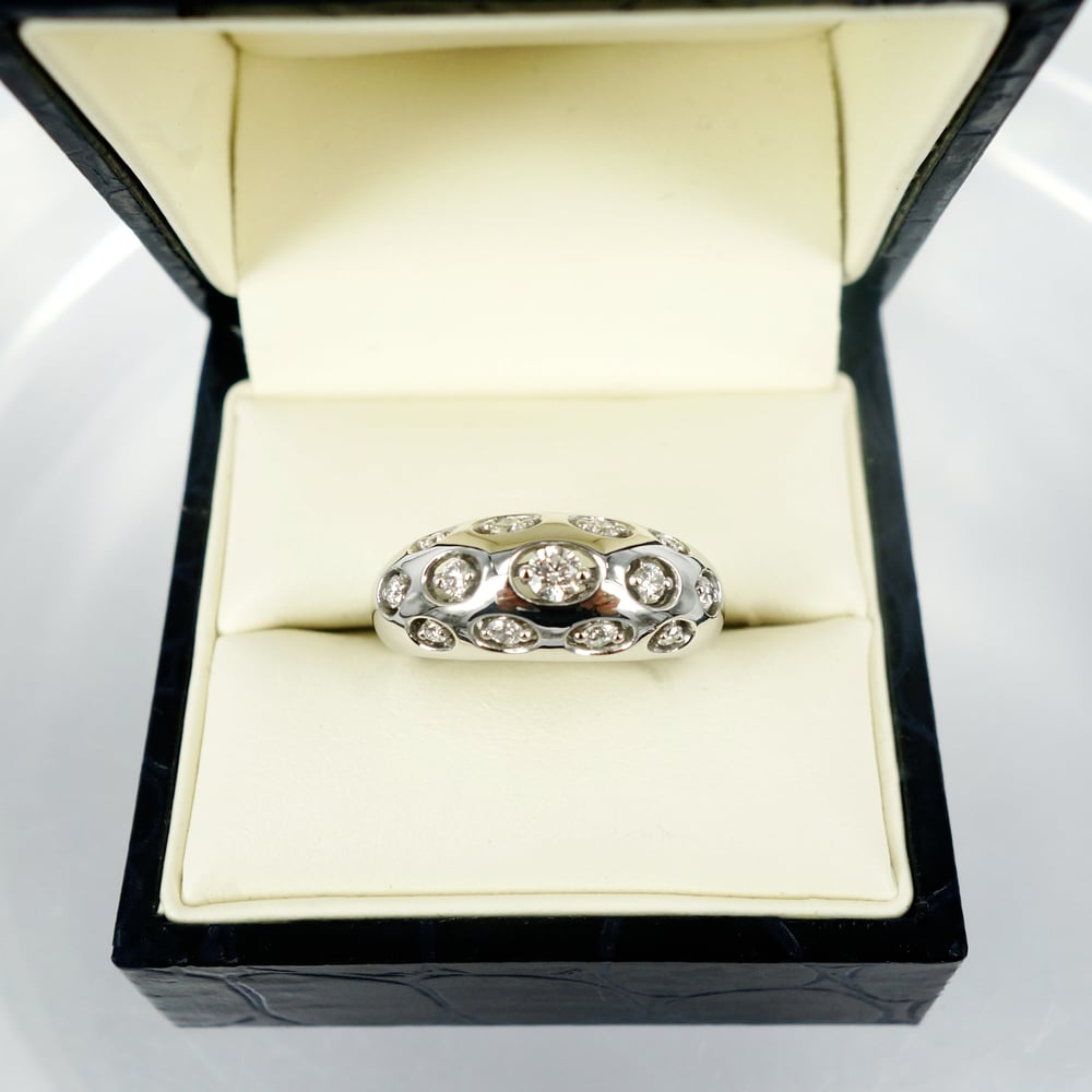 Image of 14ct white gold domed diamond set cocktail ring.      pj5458