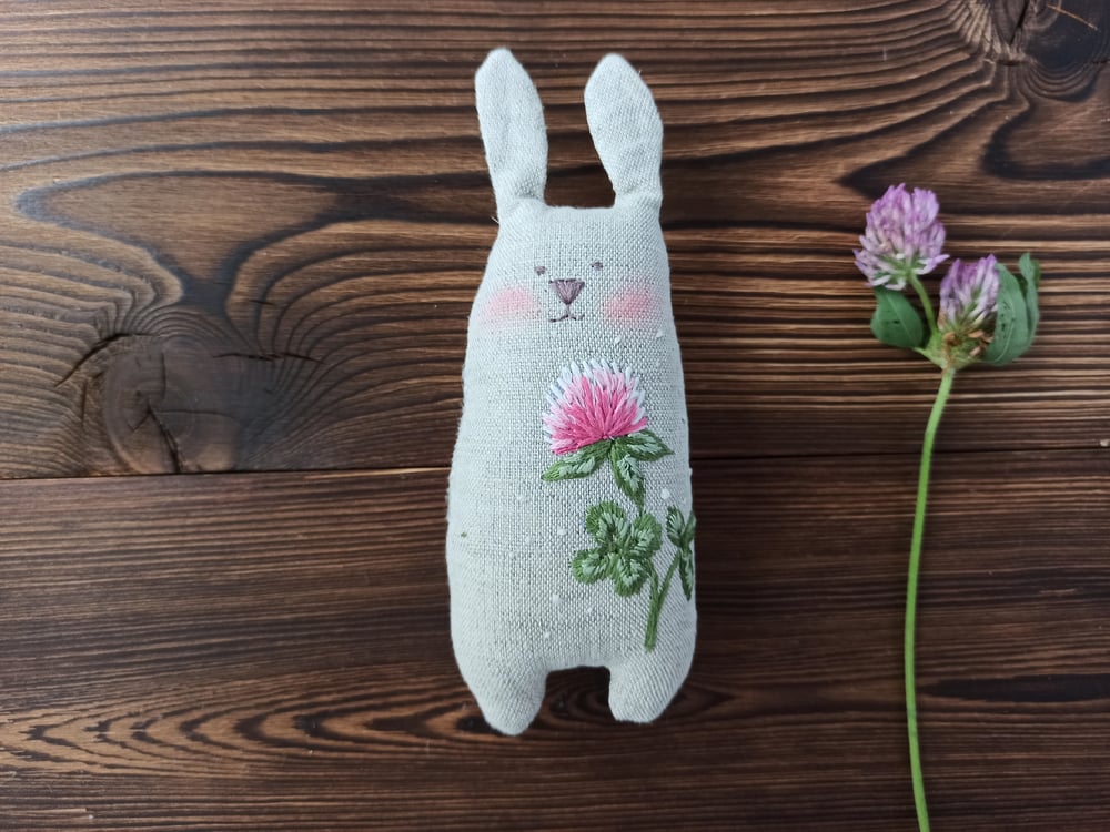 Image of Stuffed bunny with clover embroidery