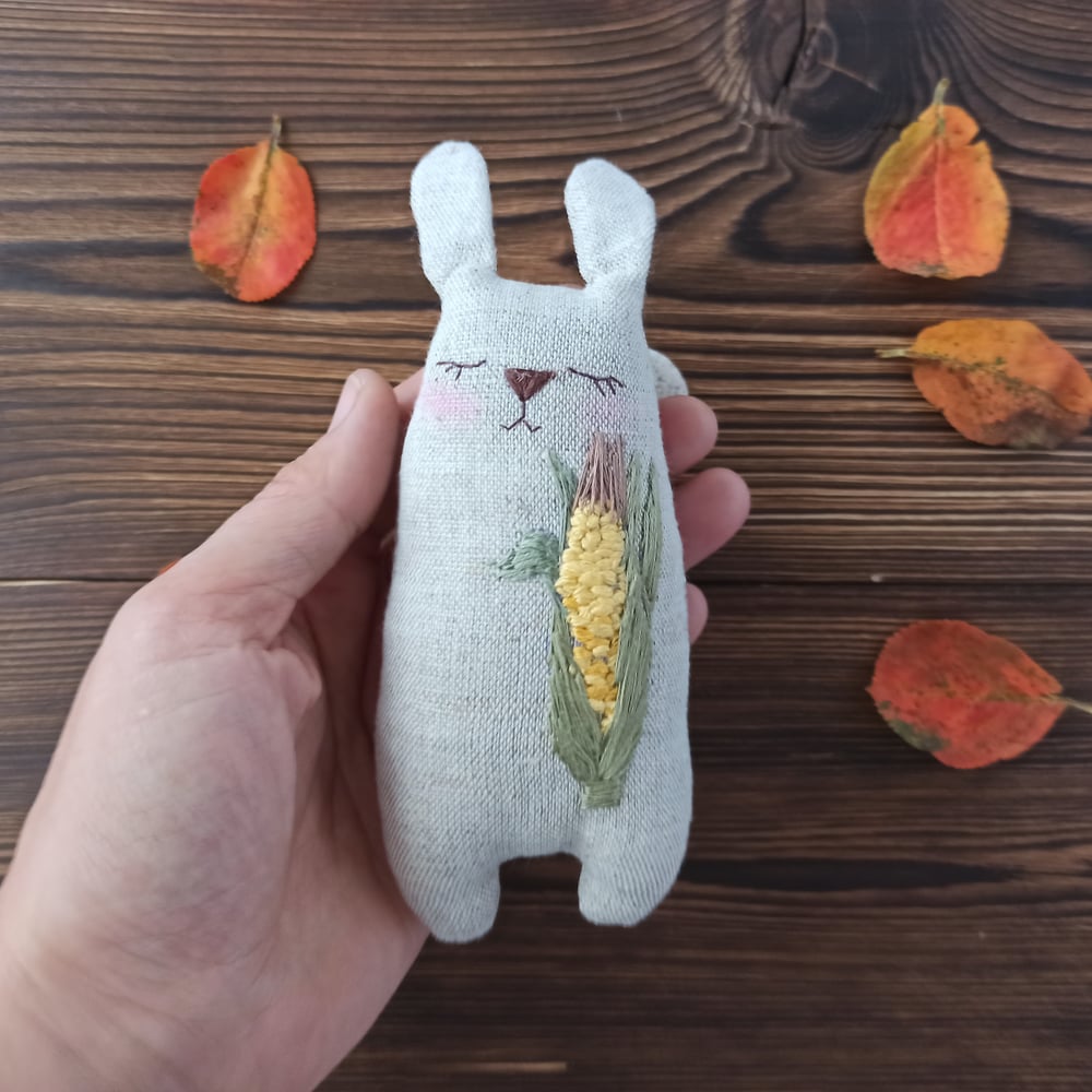 Image of Stuffed bunny with corn embroidery