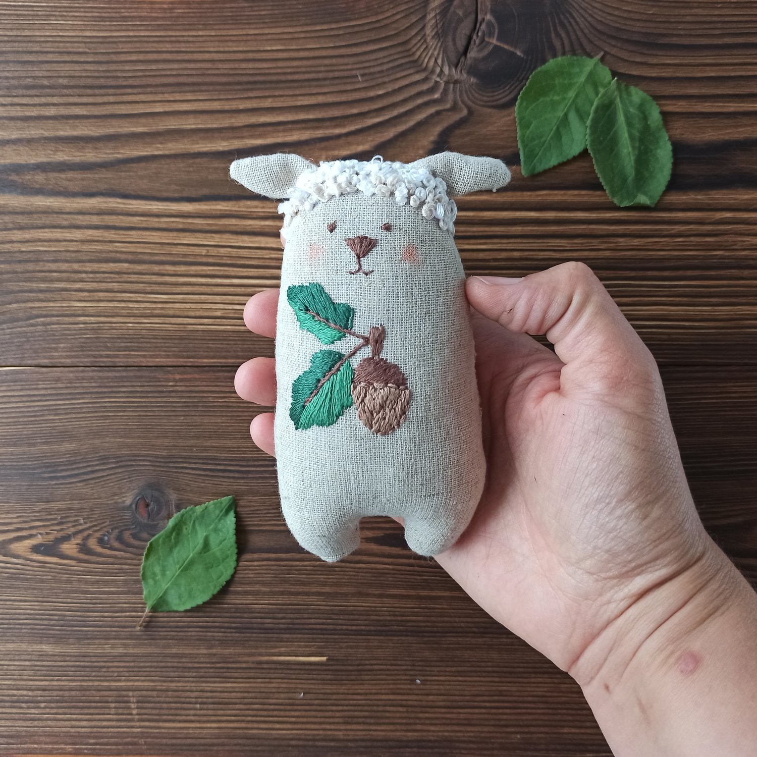 Image of Stuffed sheep with acorn embroidery