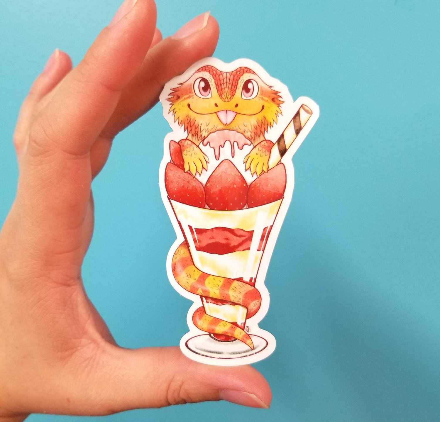 Image of Bearded dragon in a strawberry parfait waterproof outdoor vinyl sticker decal