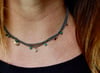 Gold and emerald multi strand necklace