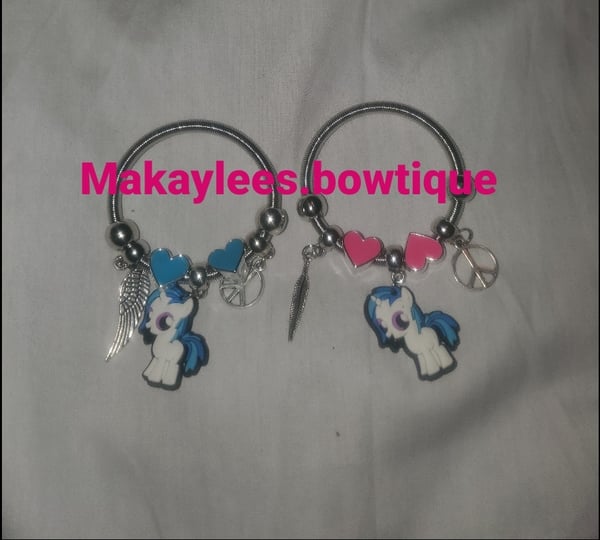 Image of Makaylees.bowtique white pony charm bracelet