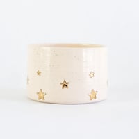 Image 1 of Golden star decorated teacup in vanilla bean glaze