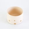 Golden star decorated teacup in vanilla bean glaze