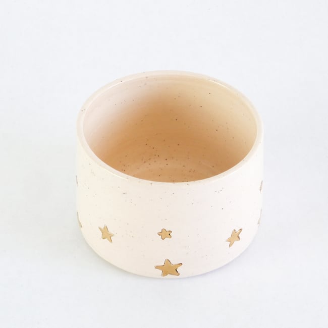 Golden star decorated teacup in vanilla bean glaze