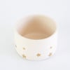 Golden star decorated teacup in white glaze 