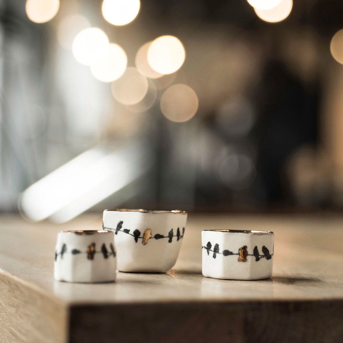 Porcelain birds on a wire ring pot