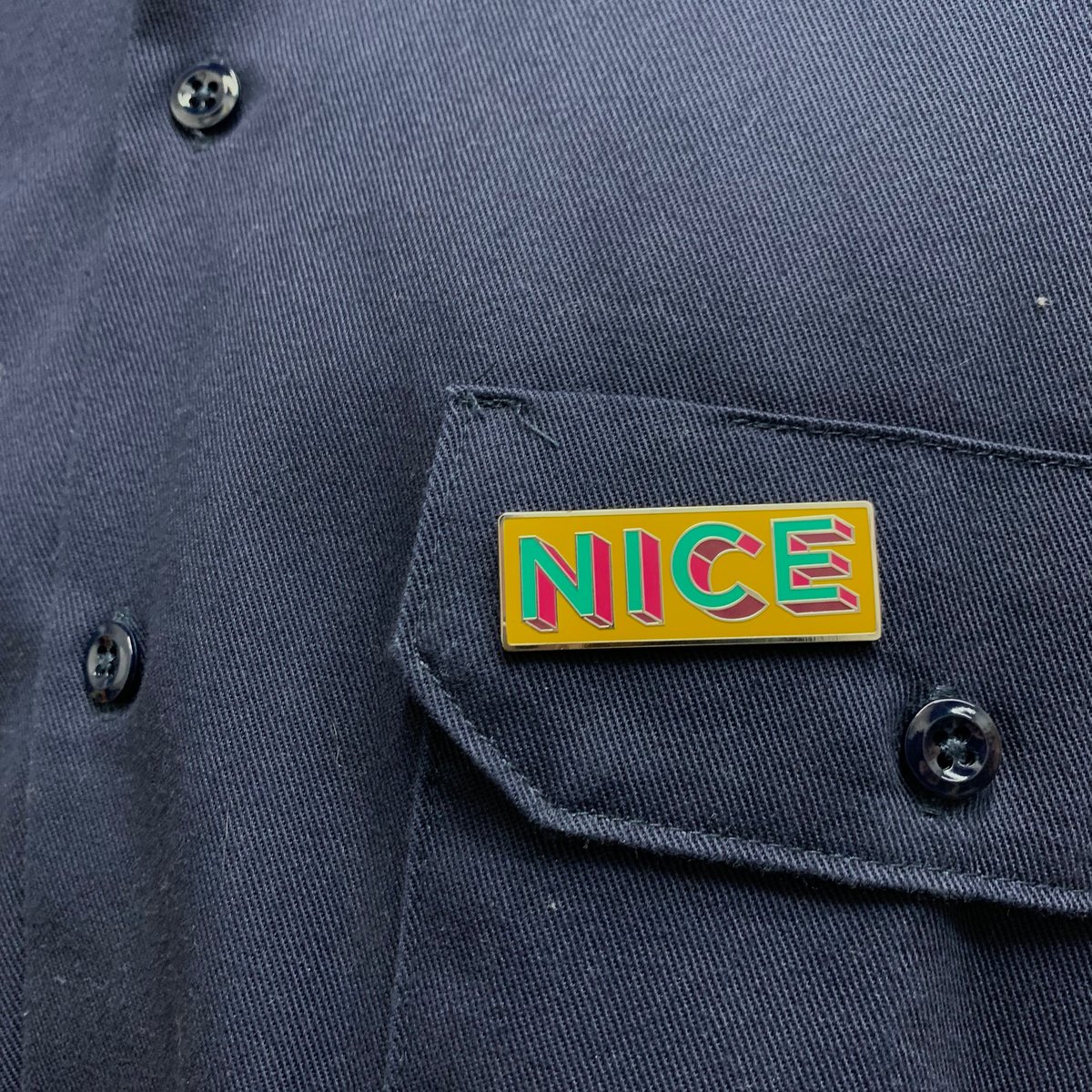 Image of ‘NICE’ Enamel Pin by Rachel E Millar