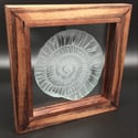 Freestanding frame with ammonite design