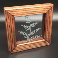 Image 1 of Freestanding frame with plant design